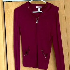 One small crimson Joy Jou women’s zip-up sweater with hood.